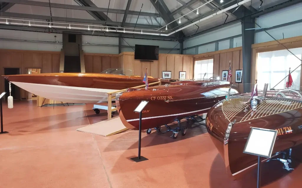 Collection of vintage wooden boats indoors
