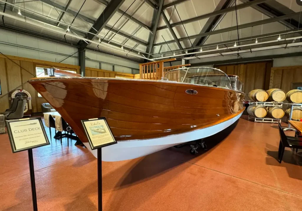 Polished wooden boat inside showroom