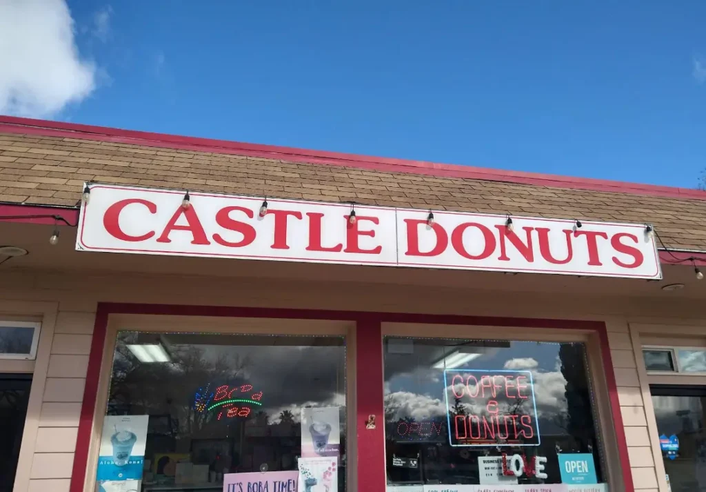 Castle Donuts storefront with coffee and donuts sign