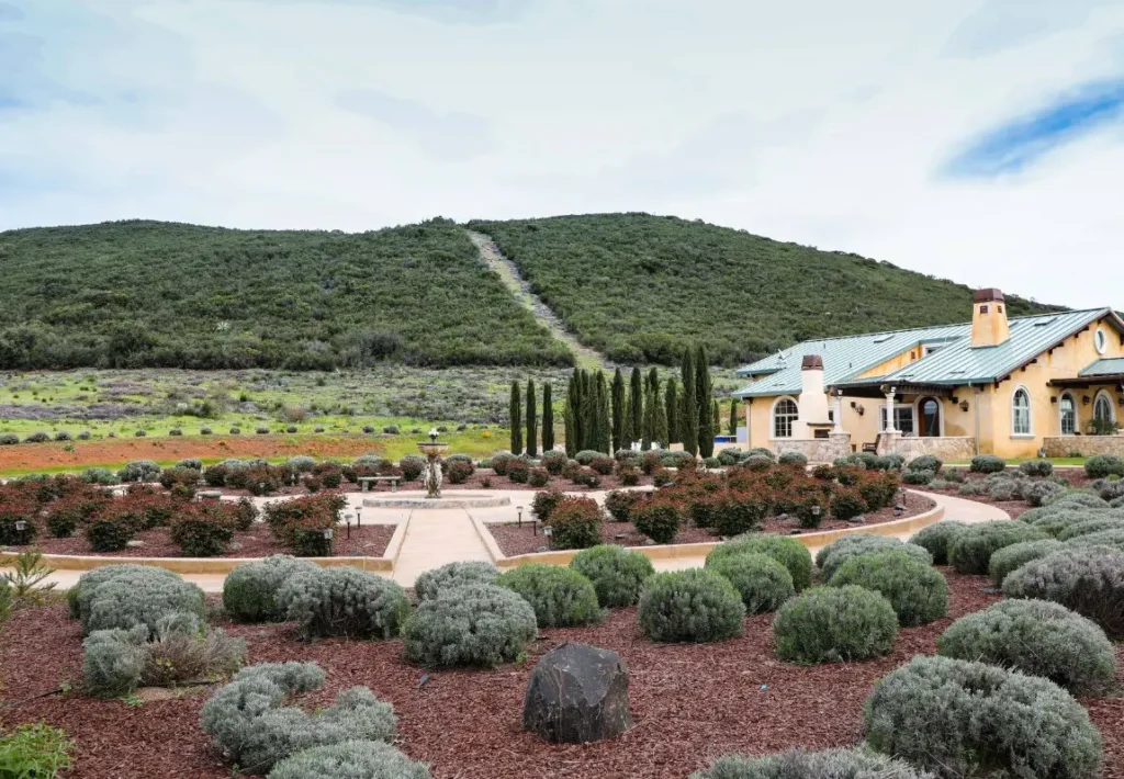 Winery estate with landscaped garden and hillside view