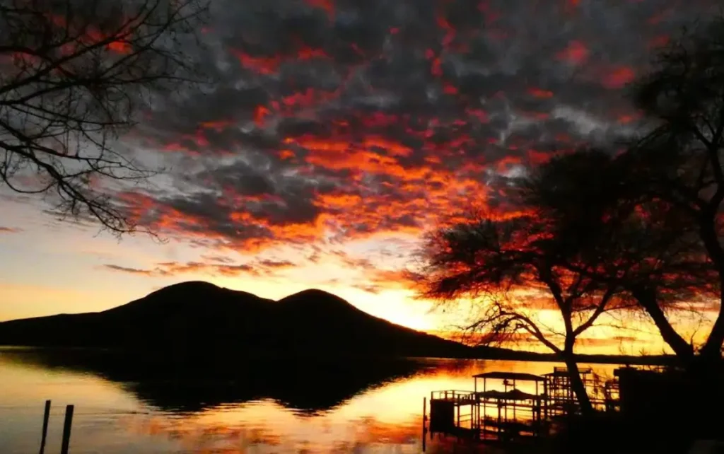 Sunset over Clear Lake with dramatic clouds and silhouetted piers